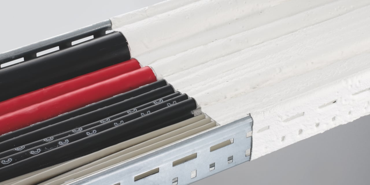 Photo of three CFS-D Firestop cable discs around a variety of electrical cables and cable bundles